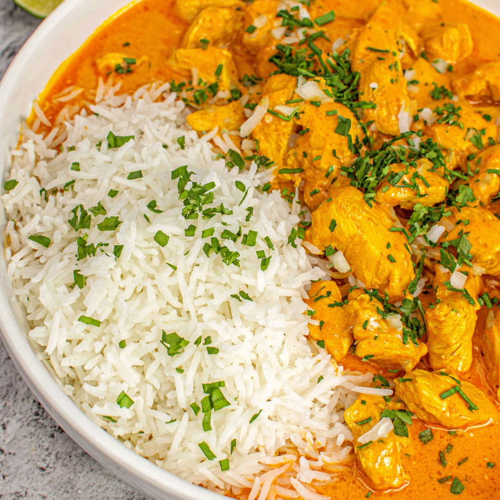 A bowl of rice and chicken.