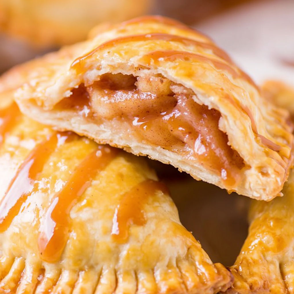 A pastry with caramel sauce and apple filling.