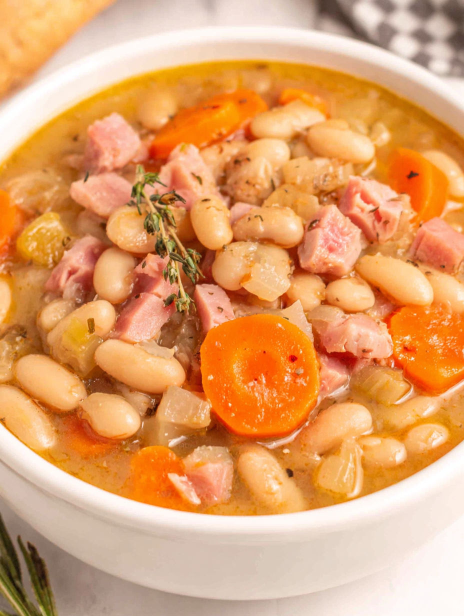 A bowl of soup with meat and vegetables.