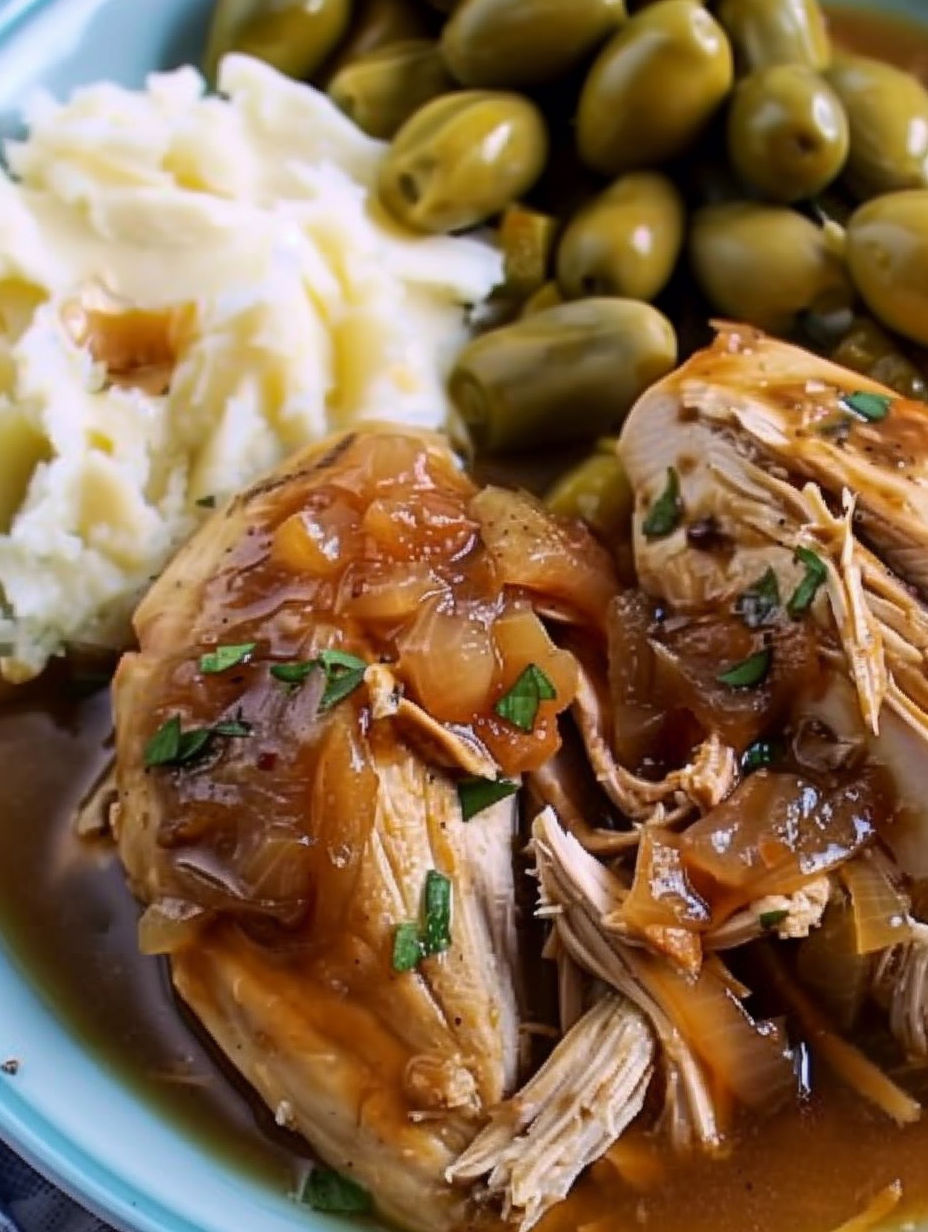 Mississippi chicken with onions and green herbs.