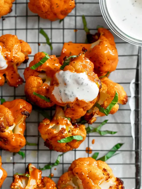 Buffalo cauliflower wings on a tray.