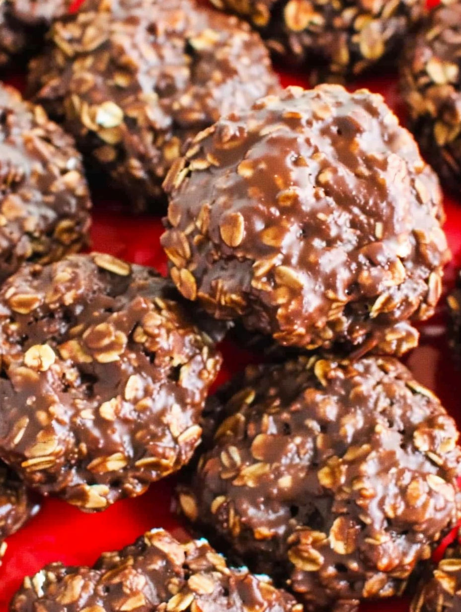 A plate of chocolate covered cookies.