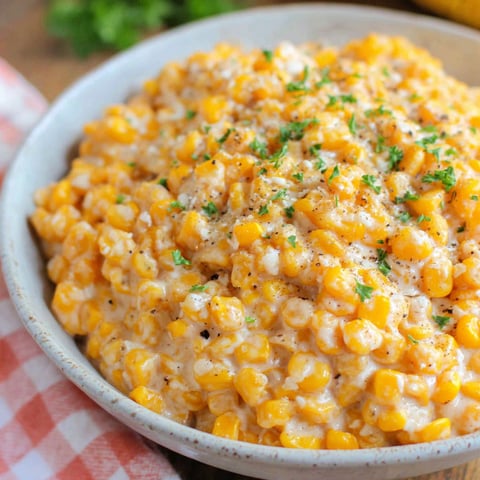 A bowl of creamed corn in a crock pot.