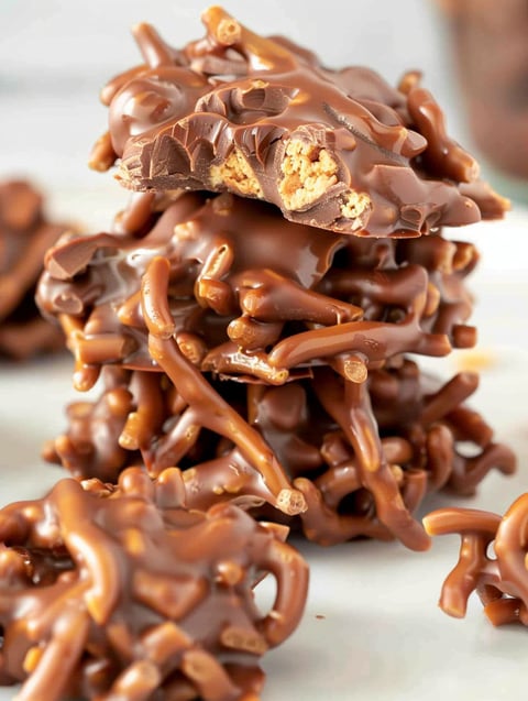 A stack of chocolate covered caramel candies.
