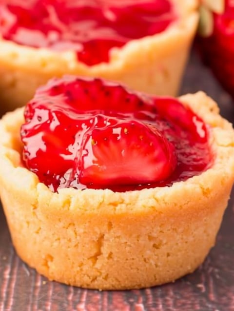 A close up of a strawberry pie cookie cup.