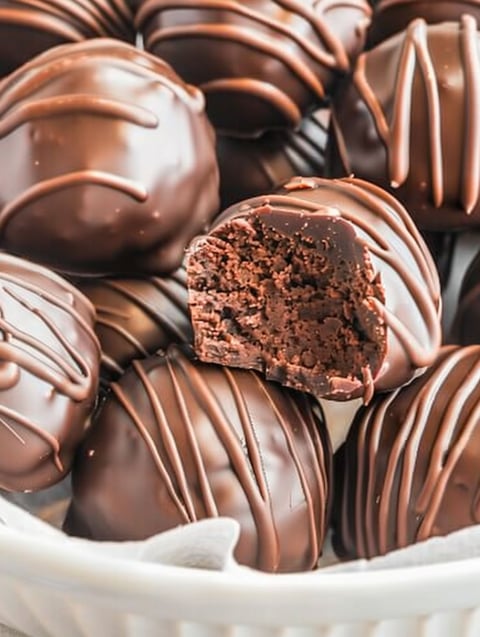 A close up of a brownie truffle.