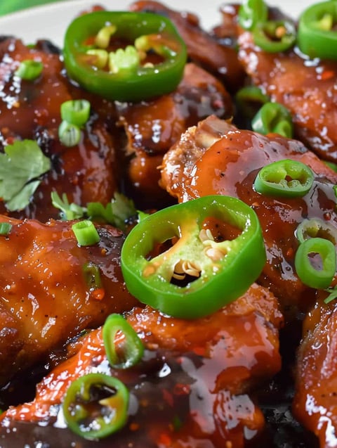 A close up of a spicy jalapeño chicken dish.