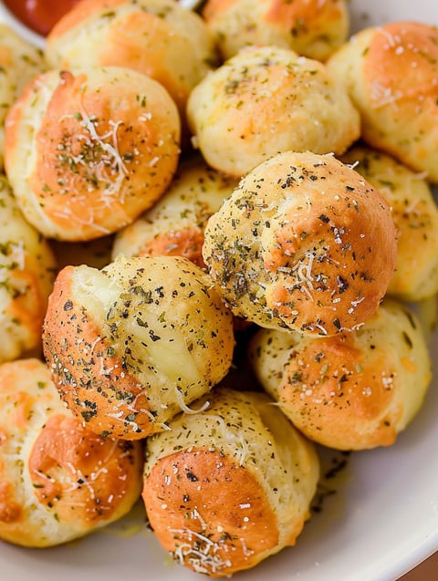 Air fryer pizza bombs with cheese and herbs.