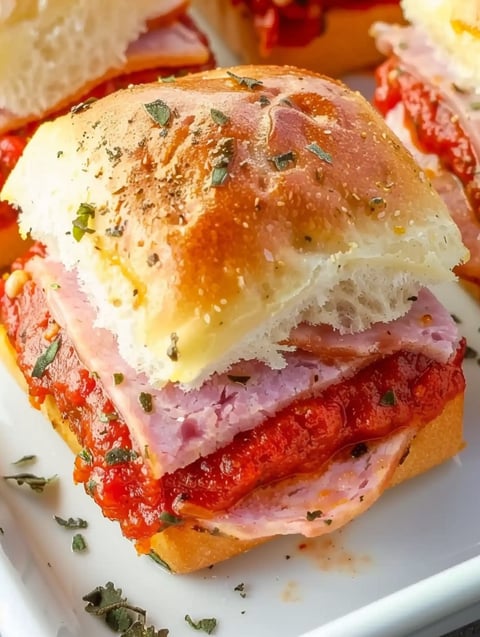 A hot Italian sub slider with meat and sauce.