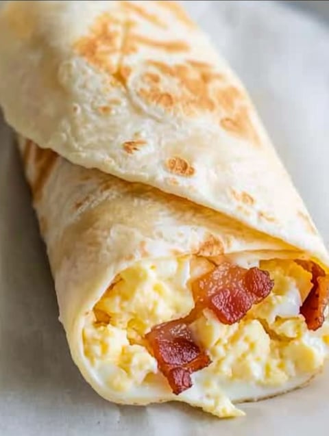 A burrito with bacon, egg and cheese.
