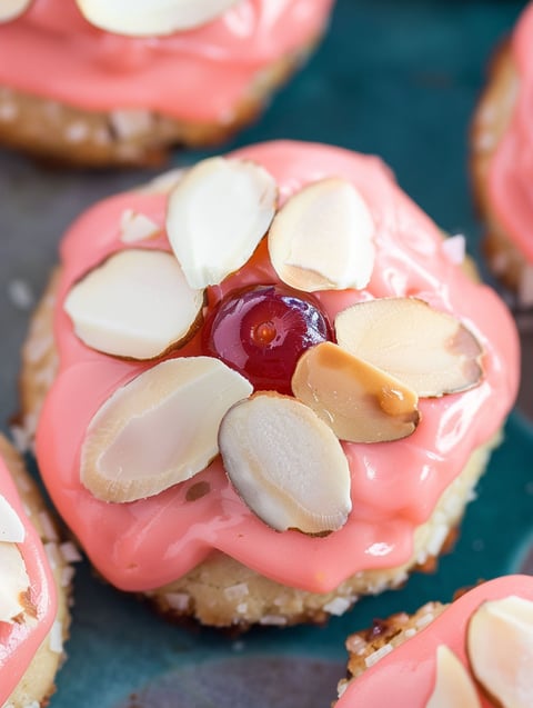 A close up of a cherry almond amish sugar cookie.