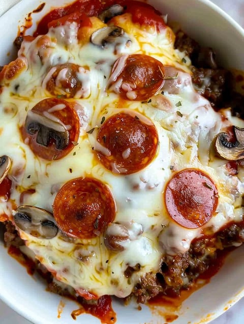 A bowl of pizza with pepperoni and cheese.