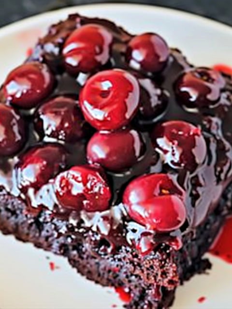 A slice of chocolate cherry upside-down cake.
