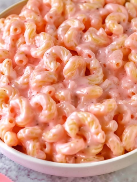 A bowl of pink mac and cheese.
