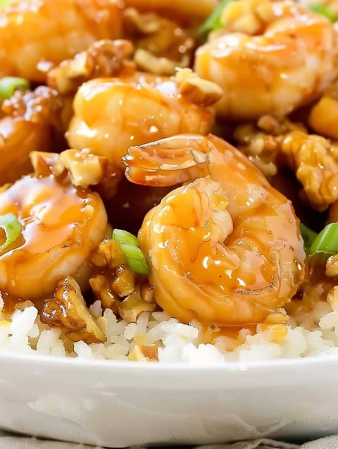 A plate of shrimp with a sauce.